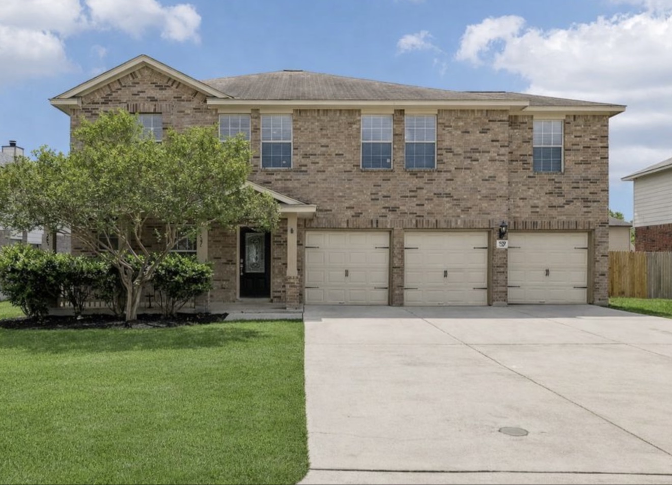 Front exterior of Foundation House, a two-story brick residence in New Braunfels